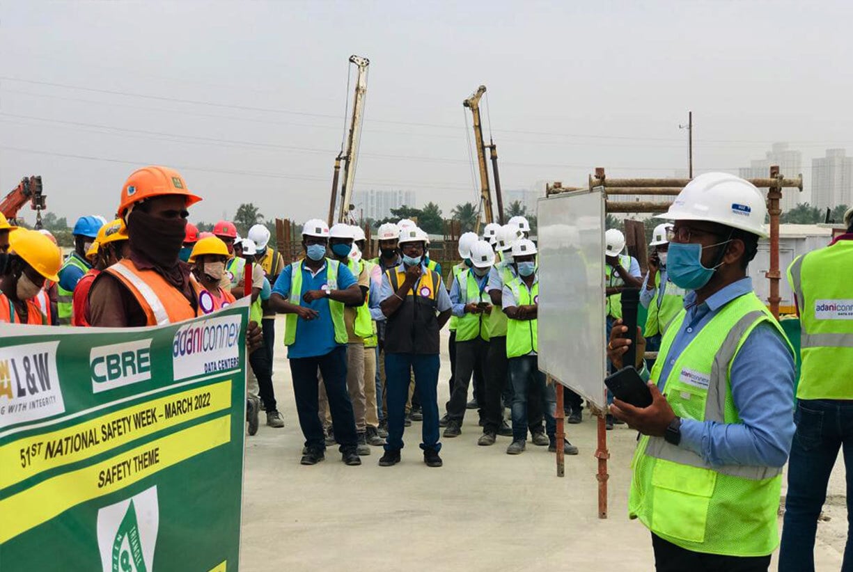 AdaniConneX Team members conducting a Safety Drill for National Safety Week